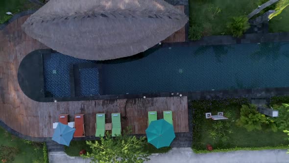 Aerial view of swimming pool between bungalow, Gili Trawangan island, Indonesia. alt