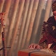 Concentrated Musician in Folk Clothes Plays Altai Harp - VideoHive Item for Sale