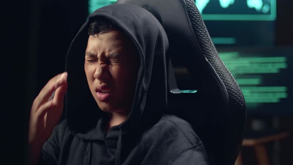 Asian Boy Hacker Using Computer Hacking And Disappointed alt