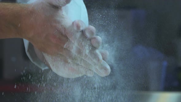 Chef Clapping Hands Filled With Flour alt