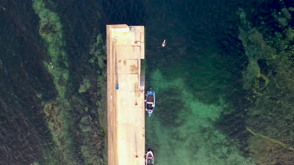 Having a Swim at the Pier of Portnoo Harbour in County Donegal Ireland alt