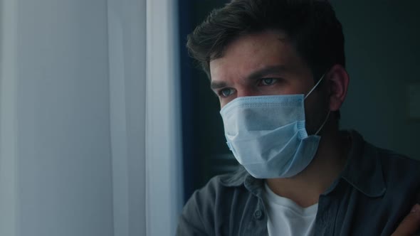Brutal Sad Man Wearing Protective Medical Mask on Face alt
