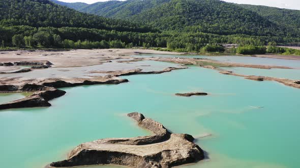Drone View of the Turquoise Lake Formed As a Result of Mining Waste alt