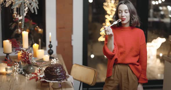 Woman Tasting a Holiday Cake alt