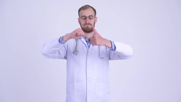 Confused Bearded Man Doctor Choosing Between Thumbs Up and Thumbs Down