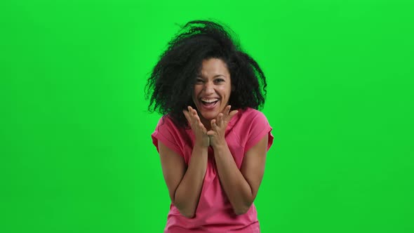 Portrait of Young Female African American Looking at the Camera with Wow Delight and Joy alt