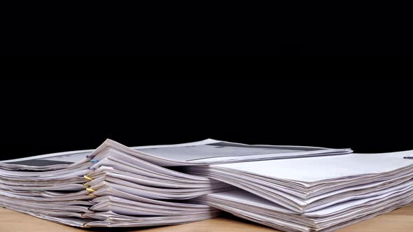 Stop motion animation Stacks overload document paper files on office desk