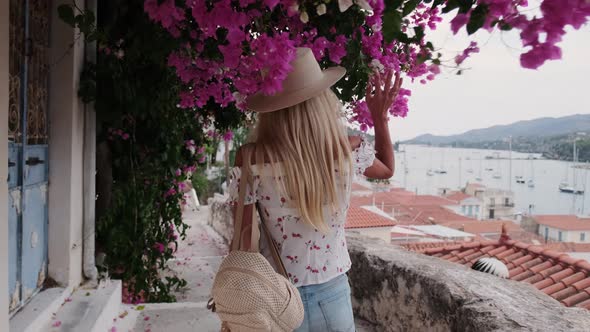 Beautiful Girl Tourist Walking in the Streets of Poros City Greece alt