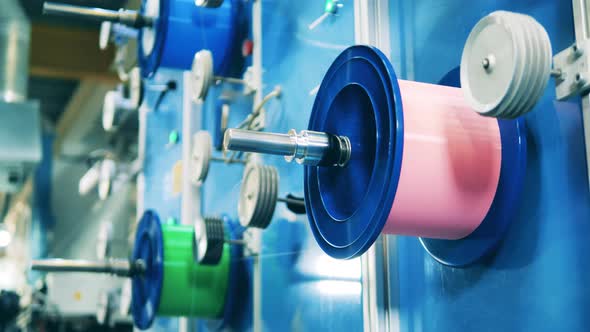 Spinning Spool with Electrical Cable at a Cable Facility alt