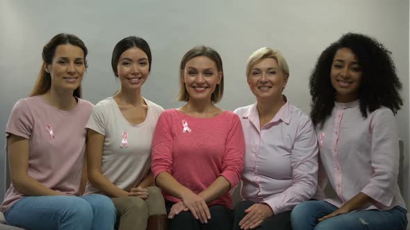 Women With Pink Ribbons Aware of Breast Cancer, Smiling Into Camera, Health alt