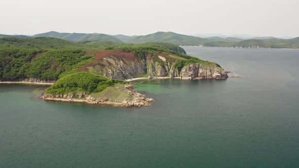 Drone View of the Rocks and Grottoes of Cape Kuzmin in the Gulf of Vladimir alt
