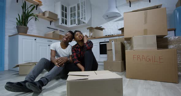 Young Couple Moving in Their New Home alt