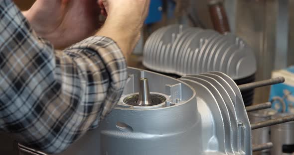 Old Motorcycle Restoration Engine Assemble After Repair and Rebuild in Garage alt