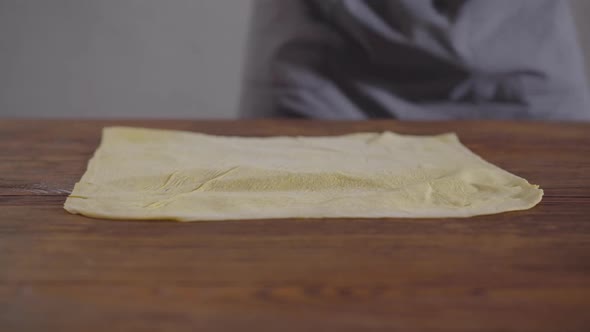 Hands of the Chef in Black Kitchen Gloves Making Shawarma alt