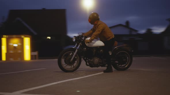 Breathtaking Drone Shot of a Motorcycle on a Parking Spot Under the Night Skies alt