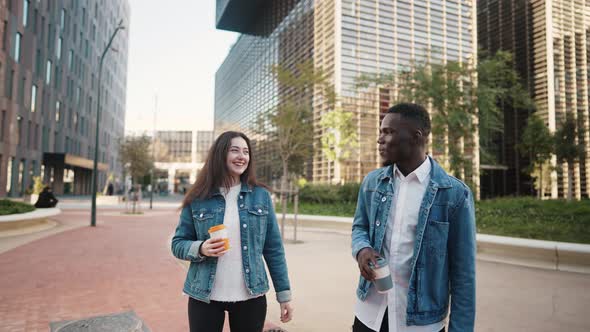 Multiracial Friends with Coffee Walking in City alt