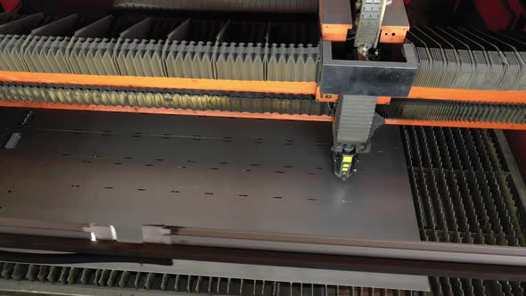 The Laser Machine Cuts A Sheet Of Metal