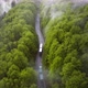 Flying Through Fog Over Road and Forest Following two Trucks During Summer - VideoHive Item for Sale
