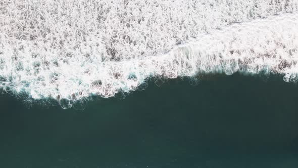 Aerial View Of waves in Dominical Beach in Costa Rica, Panning Wide Shot alt