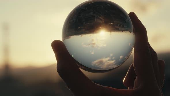 Close up of Glass Ball At Sunset alt