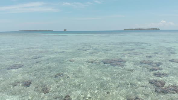 Aerial: flying over desert beach white beach tropical caribbean sea alt