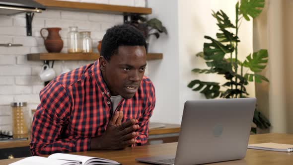 Excited African American Student Looks Laptop Celebrating Admission University alt