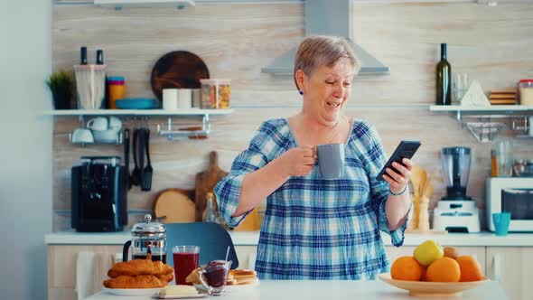 Senior Woman Enjoying Music alt