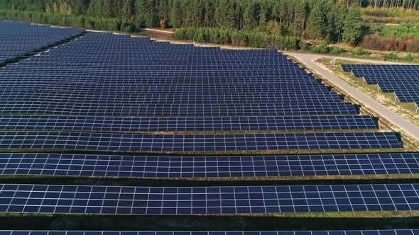 Aerial Drone Footage. Flight Over Solar Panel Farm. Renewable Green Alternative Energy