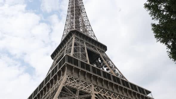 Beautiful construction of Eiffel tower and symbol of France in front of cloudy sky 4K 2160p UltraHD  alt