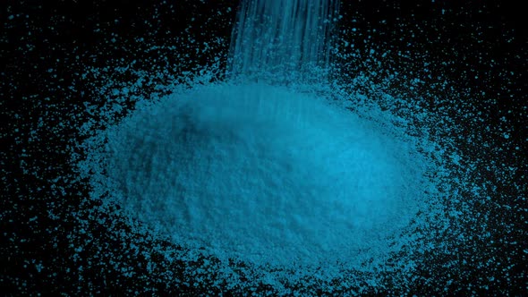 Light Blue Granules Pour Into Pile alt