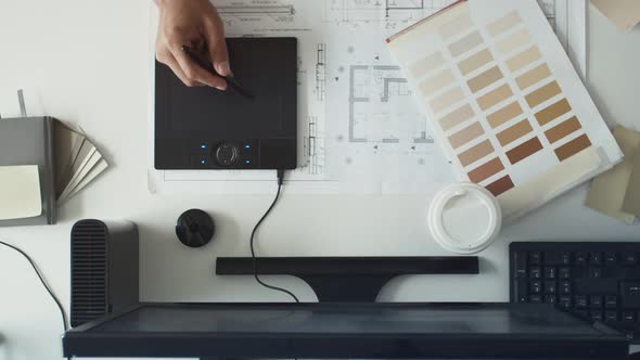 Graphic Design and Color Swatches and Light Pen on a Desk alt