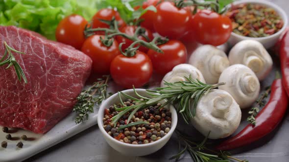 Raw Beef with Spices and Rosemary. Fresh Ingredients for Healthy Cooking