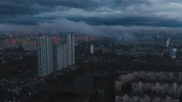 Aerial View of a Big City Cloudy Sky Tenement Buildings Near a Water Canal Evening Traffic After alt