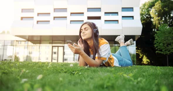 Hipster Woman Listening To Music in Headphones