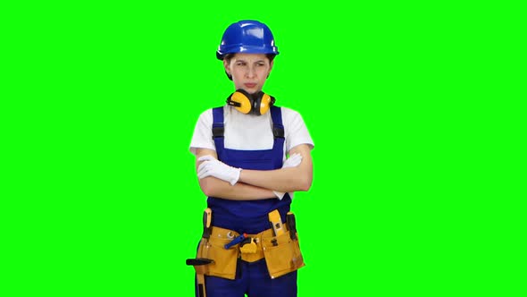 Builder Girl Showing Thumbs Down. Green Screen alt