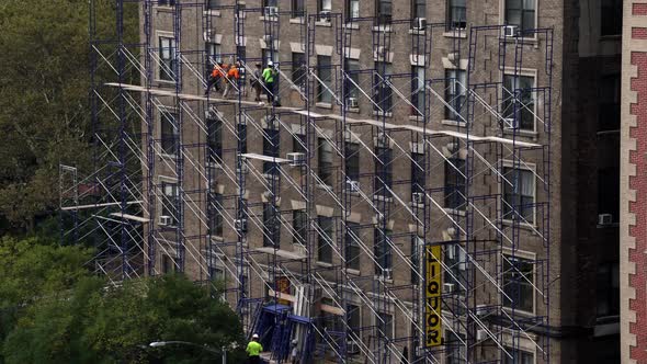 New York: Man at Work. Renovation of a Building. 