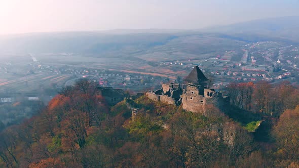 Old fairytale castle on the hill. Drone shooting from a bird's eye view.