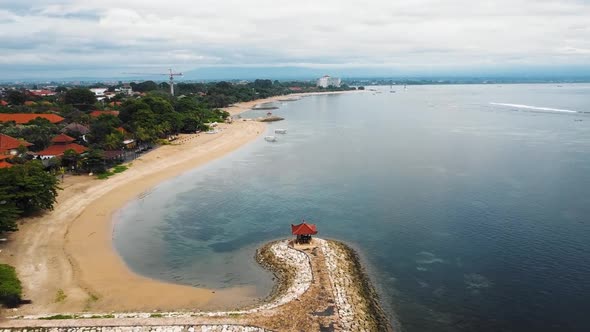 Beautiful cinematic Sanur beach, Bali drone footage with interesting landscape, fishing boats and ca alt