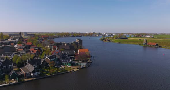 Classic well kept Dutch wooden Windmills in Zaanse Schans, Drone footage. alt