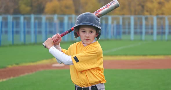 Portrait of a Boy Baseball Player on a Blurry Background, the Batter ...