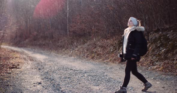 Technology - Woman Using Smartphone To Take Picture in Autumn alt