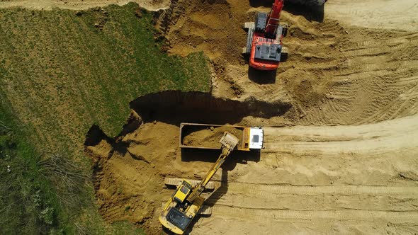 Trucks and Excavator Working alt