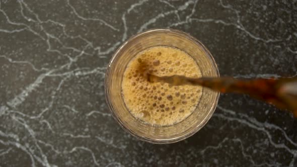 Cola Poured in the Glass in Slow Motion