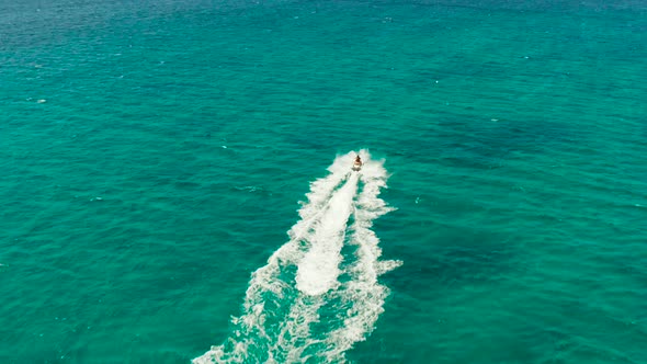 Tourists on a Jet Skis on a Tropical Resort. Boracay, Philippines alt