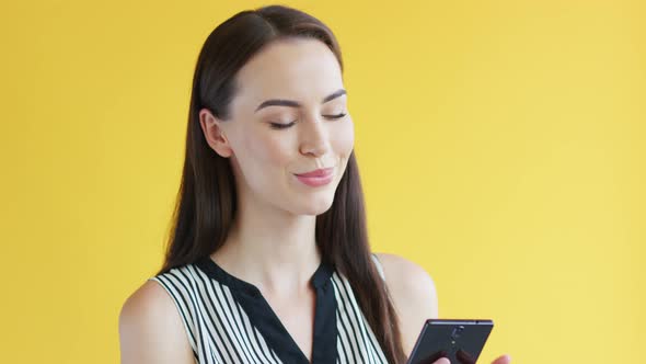Gorgeous Female Using Smartphone alt