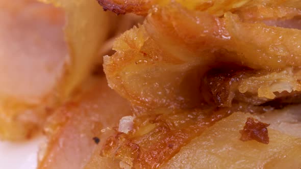 Macro shot of halal kebab meat. Shawarma meat pieces, close up view in rotating motion. alt