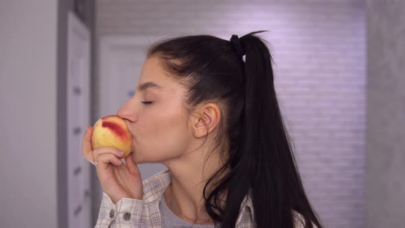 Healthy Woman Biting Juicy Peach Close Up