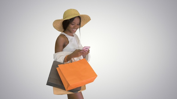Woman in Summer Outfit Using Mobile Walking on Gradient Background alt