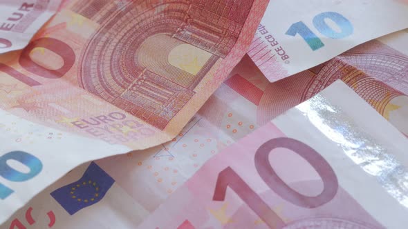 Ten euro paper banknotes in the row slow tilt 4K 2160p 30fps UltraHD footage- Slow tilting  on lot o alt