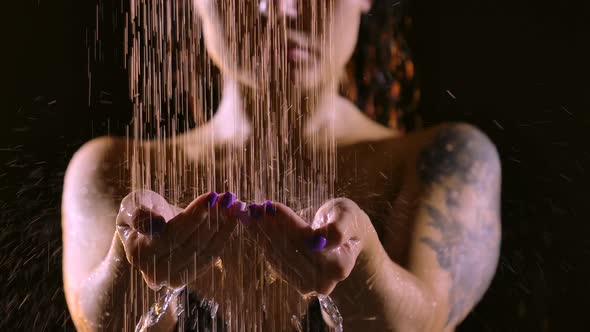 Attractive Woman Takes a Shower in Slow Motion on a Black Studio Background. Close Up Beautiful alt